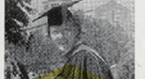 A grainy black and white photograph of Marion Lucy Queal in graduation regalia with trees and buildings in the background.