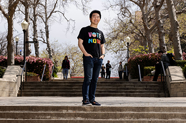 Shi wearing wearing a shirt that says, "VOTE NOW," on Bruin Walk.
