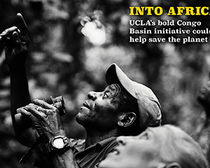 A black and white photograph of two people looking up while one holds binoculars. On the right-hand side the words "INTO AFRICA: UCLA's bold Congo Basin Institute could help save the planet."
