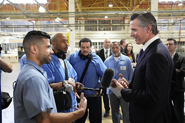 Gov. Gavin Newsom speaking to inmates at San Quentin last year. His administration opposed heat standards for prisons.