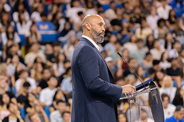 UCLA Interim Chancellor Darnell Hunt stands at a podium