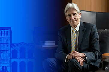 UCLA Chancellor-designate Dr. Julio Frenk seated in front of Royce Hall with partial blue tinted treatment