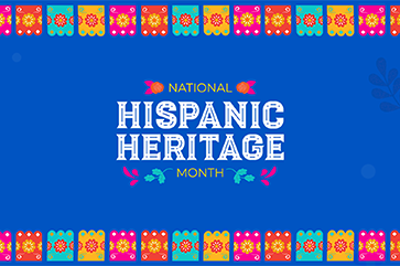 A blue banner that reads "National Hispanic Heritage Month" adorned with illustrations of papel picado.