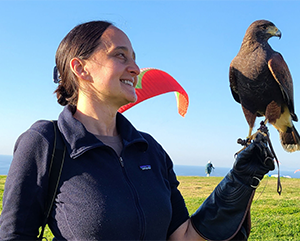 Nurit Katz wearing a glove and holding a falcon