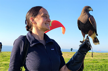 Nurit Katz wearing a glove and holding a falcon