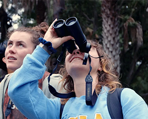 Students from UCLA's Bruin Birding Club outside.