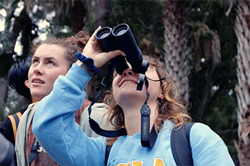 Students from UCLA's Bruin Birding Club outside.