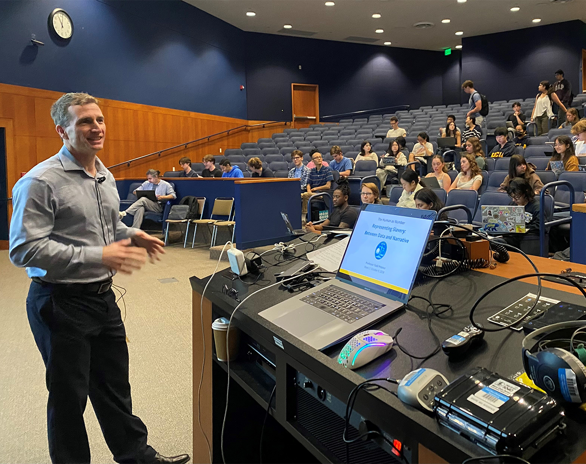 Todd Presner delivering a speech to a classroom. 