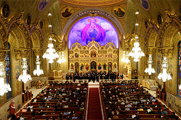 Interior of Saint Sophia Greek Orthodox Church with performers on stage