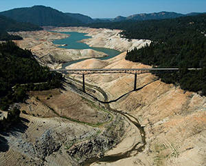 A photo of the Enterprise Bridge passes over a section of Lake Oroville that was nearly dry on Sept. 30, 2014, in Oroville, California.