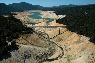 A photo of the Enterprise Bridge passes over a section of Lake Oroville that was nearly dry on Sept. 30, 2014, in Oroville, California.