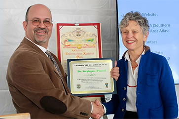 Steven Steinberg, L.A. County’s Geographic Information Officer, presents Pincetl with an award at the county’s 17th annual GIS Day.