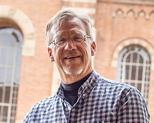 Portrait of Professor William Schniedewind with UCLA Powell Library in background