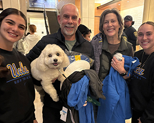 The UCLA softball team visits the Luskin Conference Center bringing their Bruin spirit to those evacuated due to the fires.