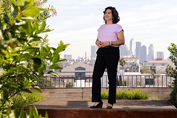 Castro Ramírez on the rooftop of the Eaves in Koreatown, which provides 57 affordable housing units in Los Angeles.