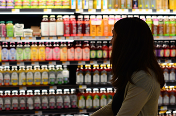 A woman grocery shopping.