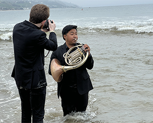 Aric Klein photographing Vincent Jurado in Malibu during the group's visit