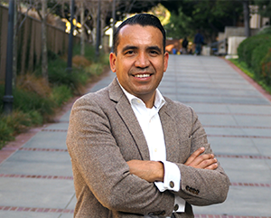Osvaldo Gutierrez with arms crossed.