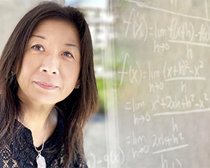 Sierra Chen and a chalkboard with equations