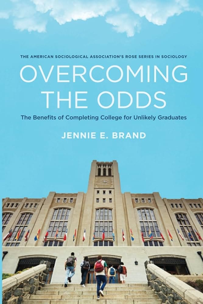 Book cover for Overcoming the Odds by Jennie E. Brand, featuring a large, historic academic building with flags and students walking up steps under a clear blue sky.