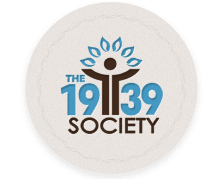 Logo for The 1939 Society featuring a stylized human figure with outstretched arms forming a tree with blue leaves, and the text THE 19 39 SOCIETY in blue and brown letters.