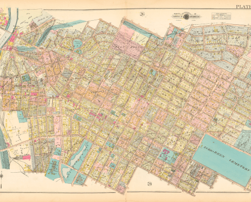 A detailed, colorful vintage map showing city streets, blocks, and landmarks with labeled areas, bodies of water, and parks. The map is densely packed with labeled plots and borders, oriented diagonally on a cream background.