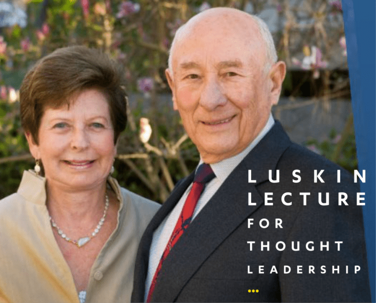 A smiling older man in a suit and tie stands next to a smiling older woman in a cream-colored top, with greenery and pink flowers in the background. Text reads: Luskin Lecture for Thought Leadership.
