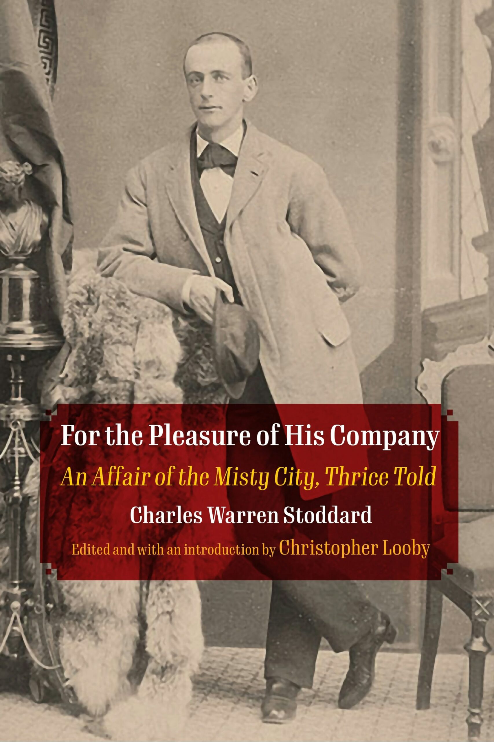 A sepia-toned photograph of a man in a formal suit with a long coat, standing beside a table with a decorative cloth. Overlaid text reads: For the Pleasure of His Company: An Affair of the Misty City, Thrice Told by Charles Warren Stoddard.